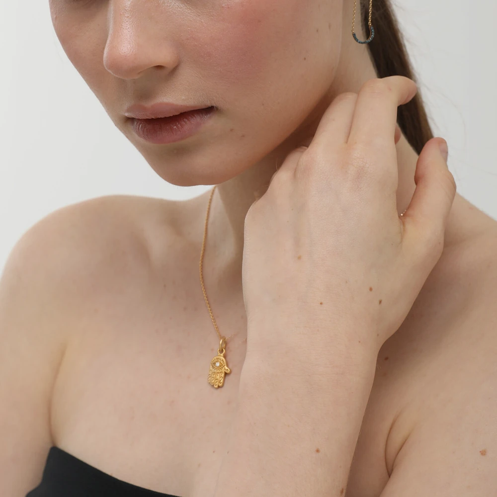 Amulet Pendant | 24k gold pendant on a model