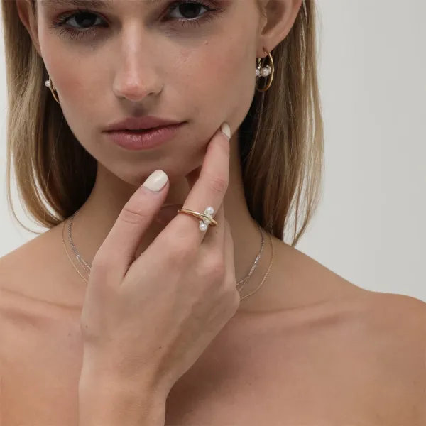 Mireya Ring | 18k gold ring on a model, showing the pearl face