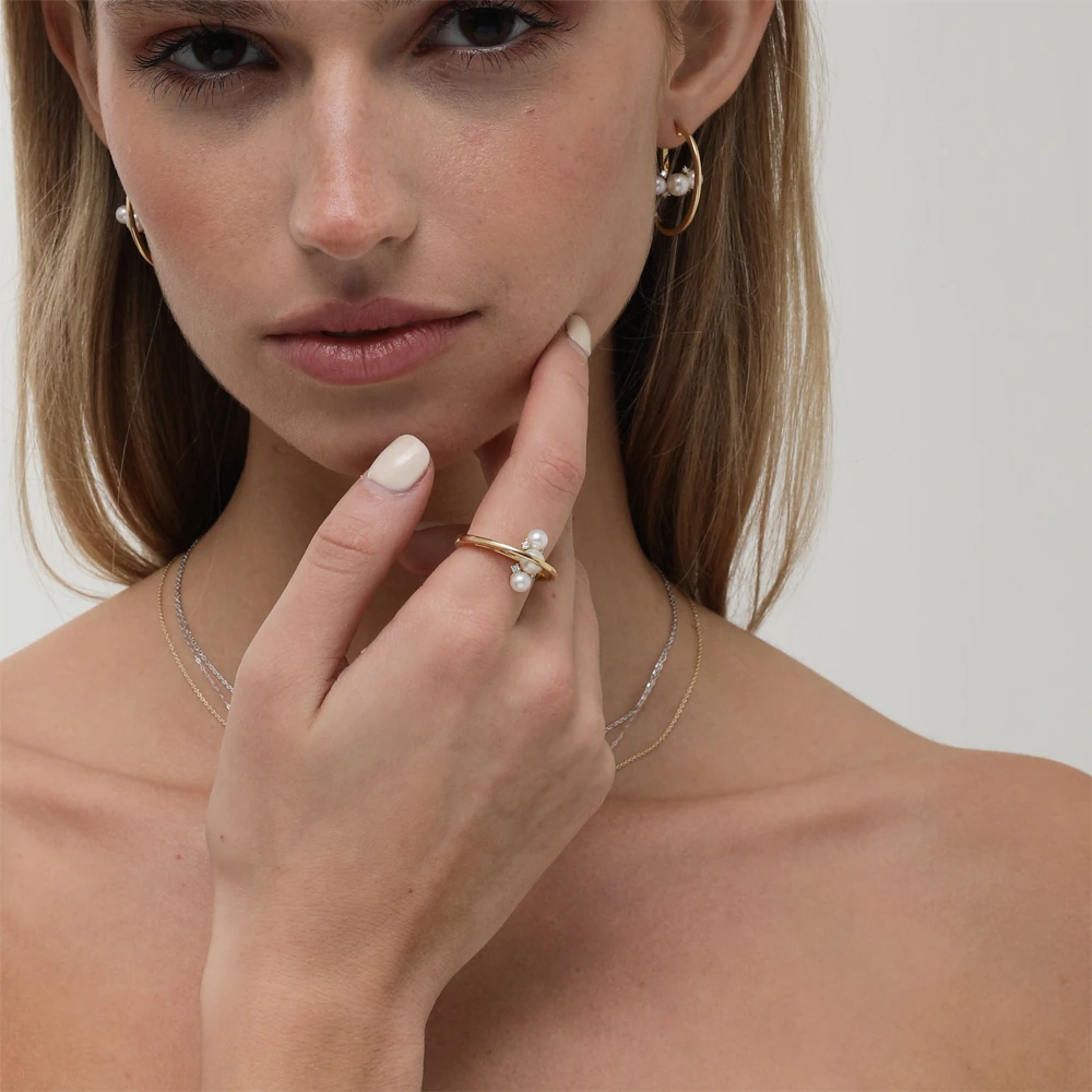 Mireya Ring | 18k gold ring on a model, showing the pearl face