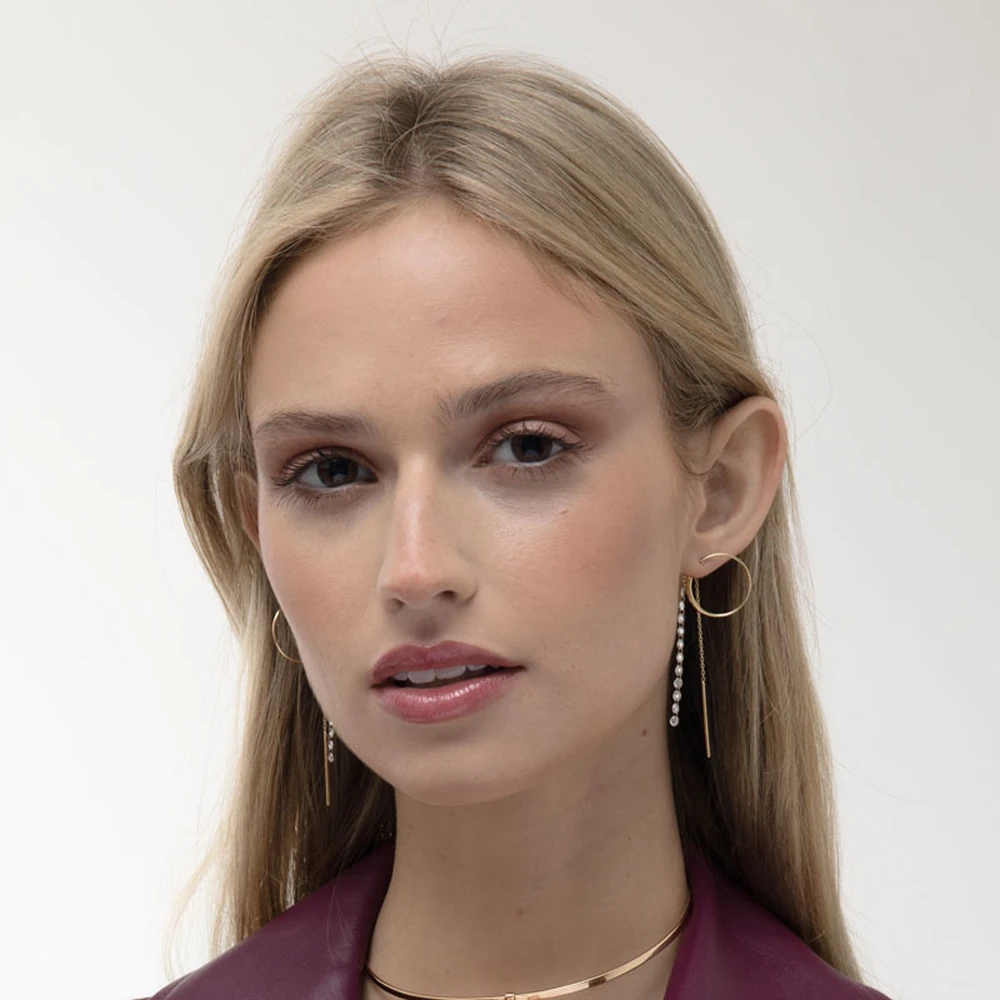Alera Earring | 18k gold earrings on a model